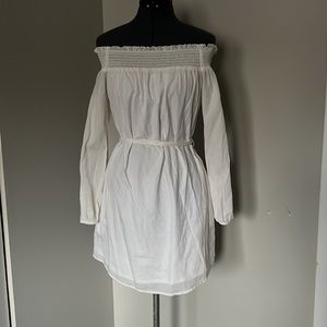 White dress with ruching at neckline and pockets